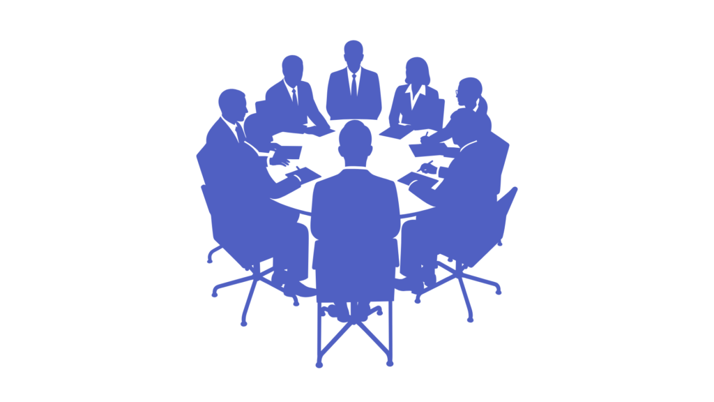 קבוצת אנשים יושבת סביב שולחן בדיון על כסף וקבלת החלטות פיננסיות